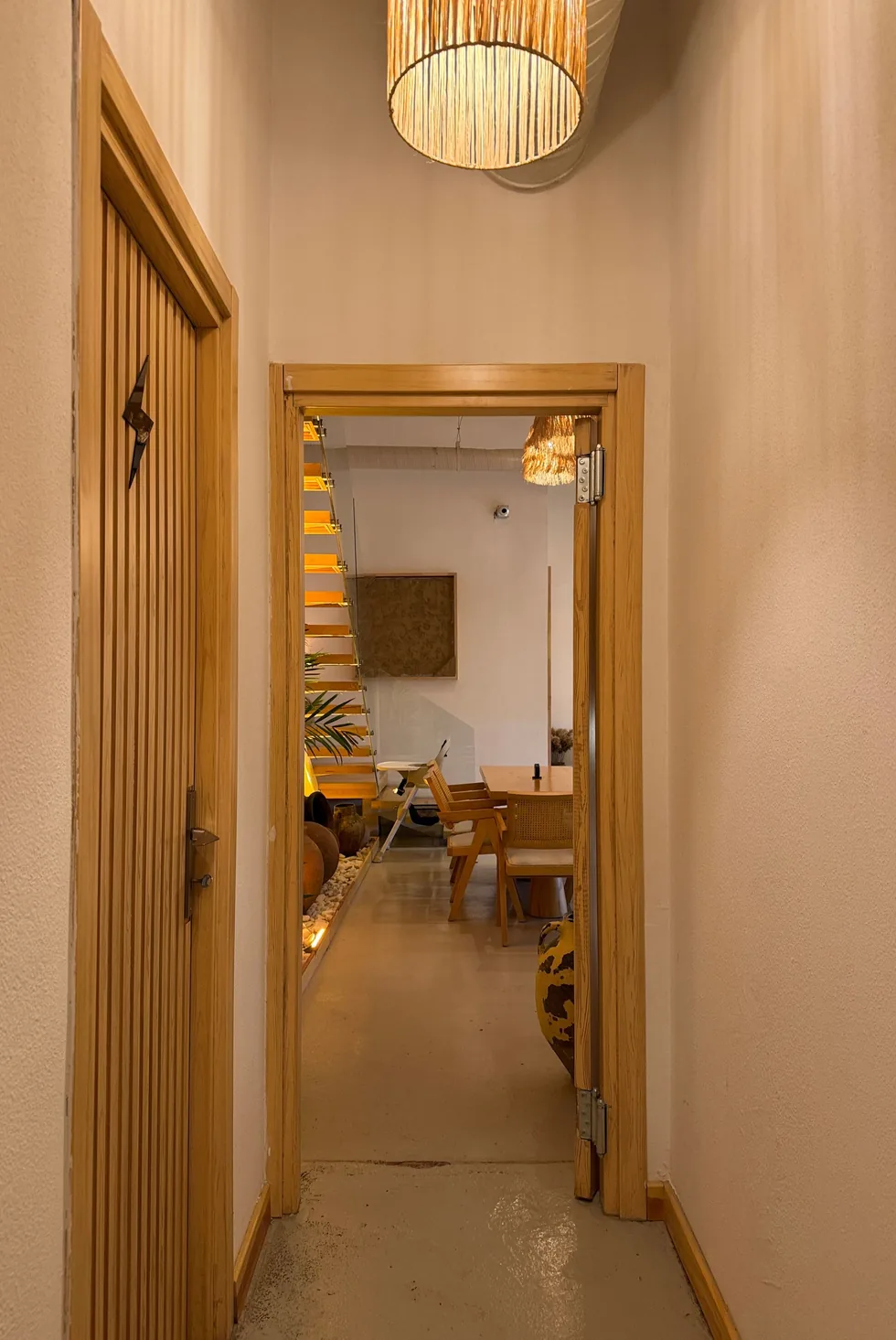 An inviting doorway opening onto a warmly lit interior
