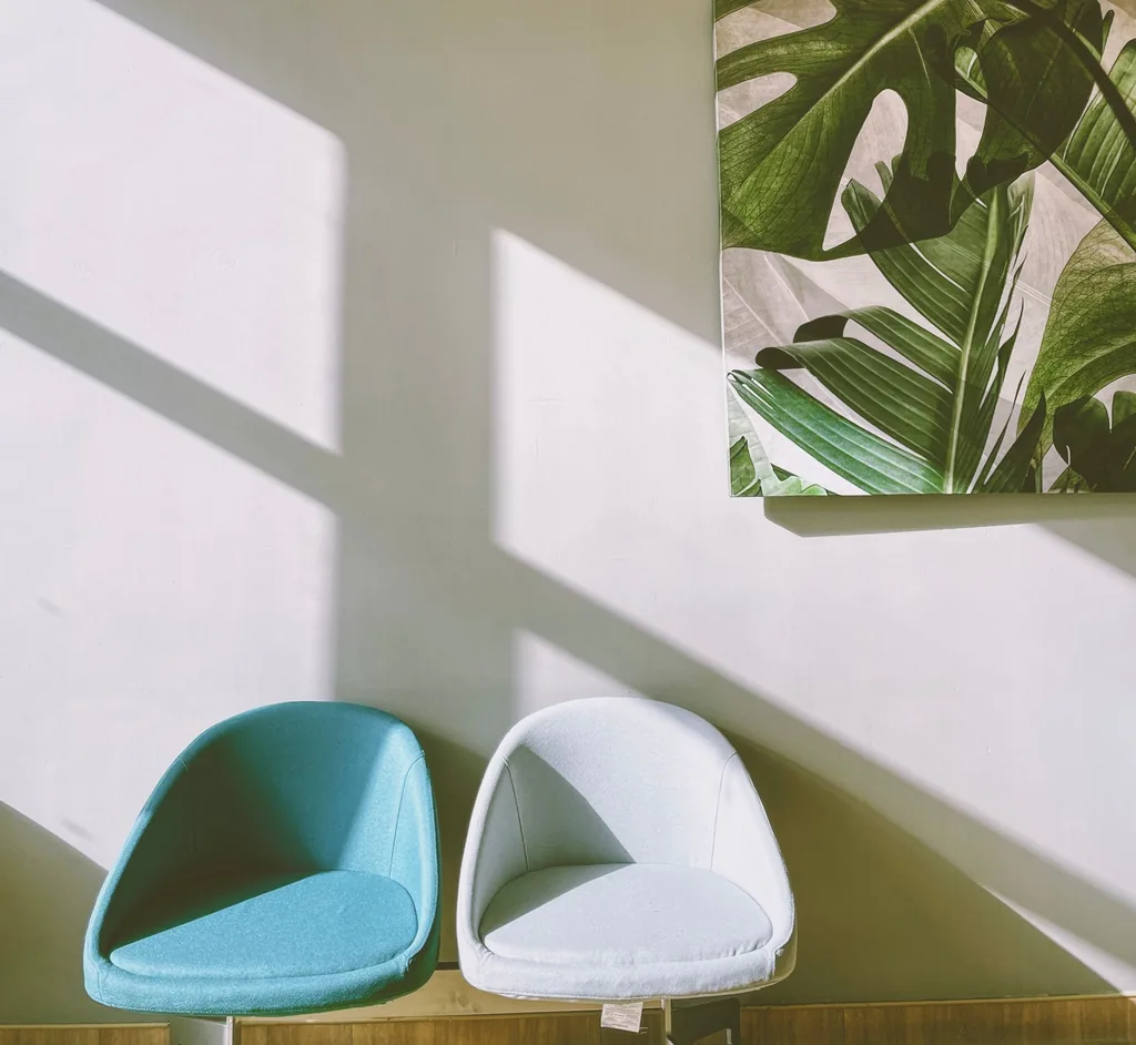 Two chairs facing each other in a bright, modern room