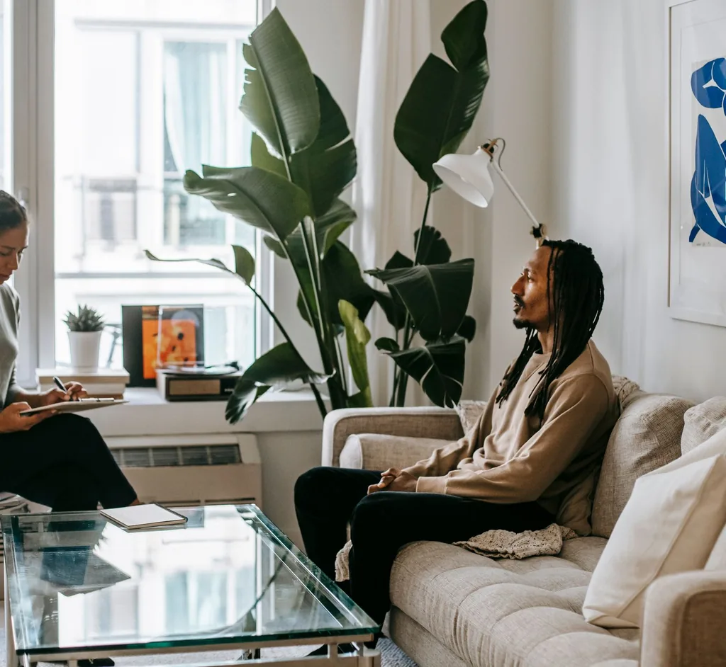 Therapist and client in a calm, light-filled room during an EMDR therapy session